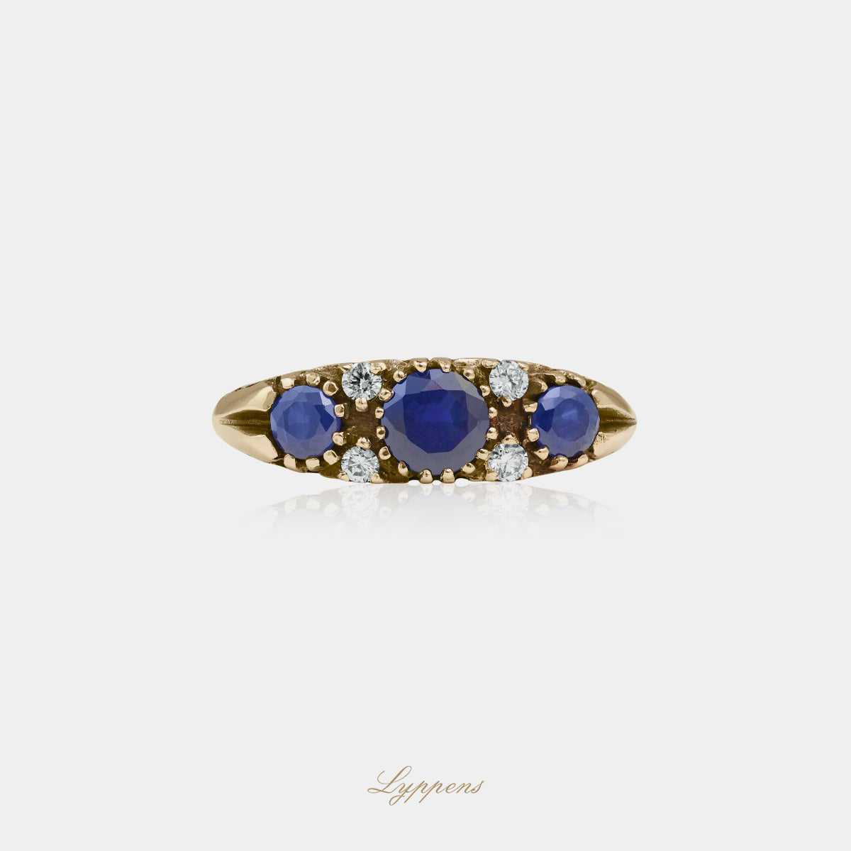 Yellow gold ring with sapphire and diamonds