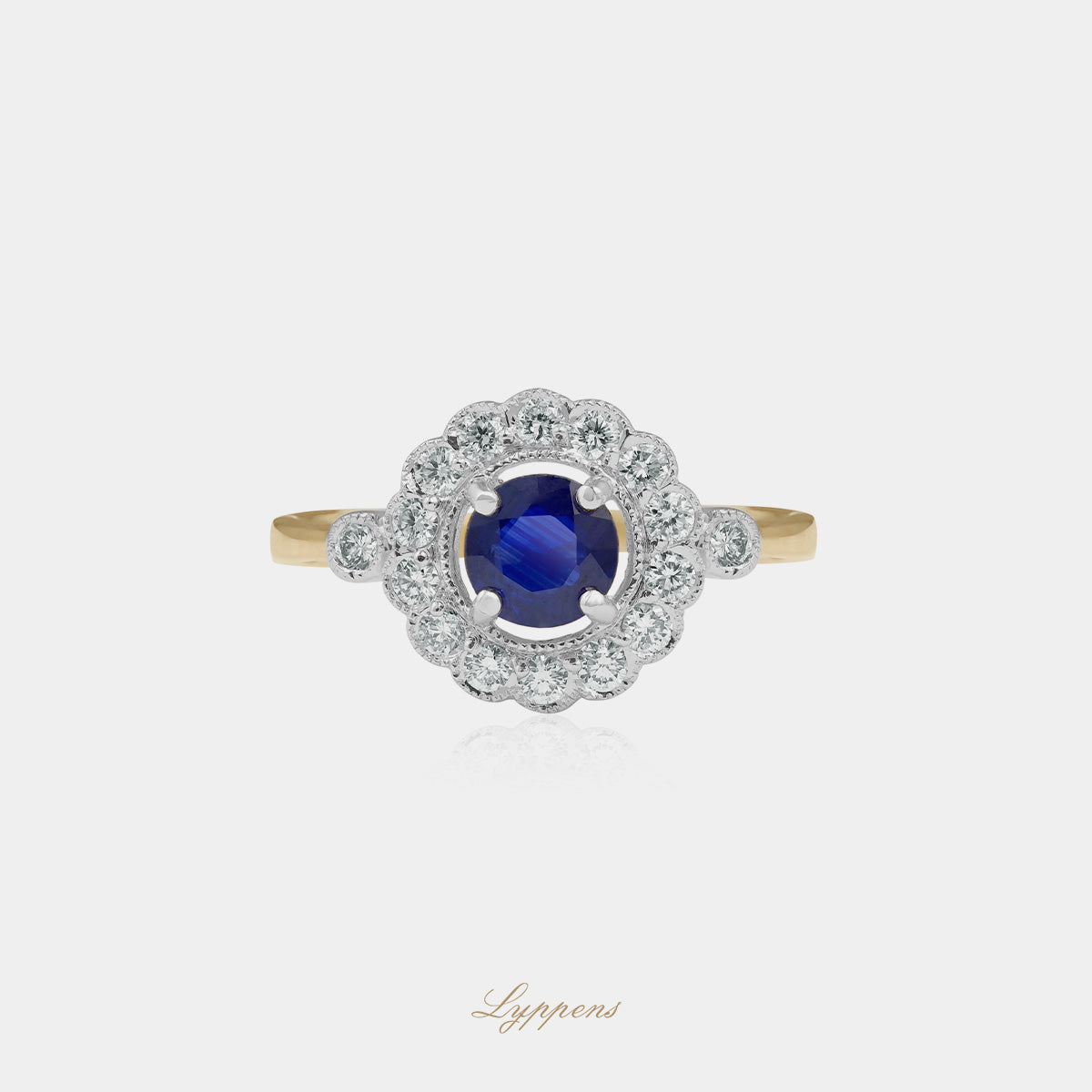 Yellow and white gold ring with sapphire and diamonds