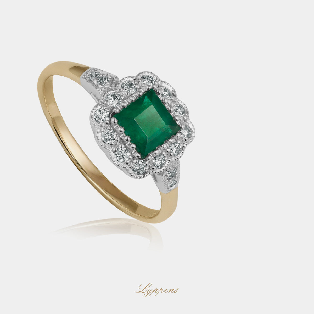 Yellow and white gold ring with emerald and diamonds