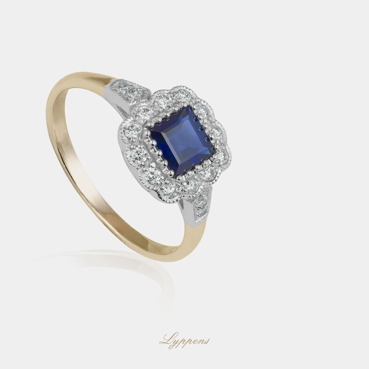 Yellow and white ring with sapphire and diamonds