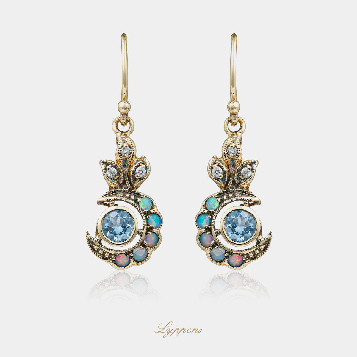 Yellow gold earrings with topaz, opal and diamonds