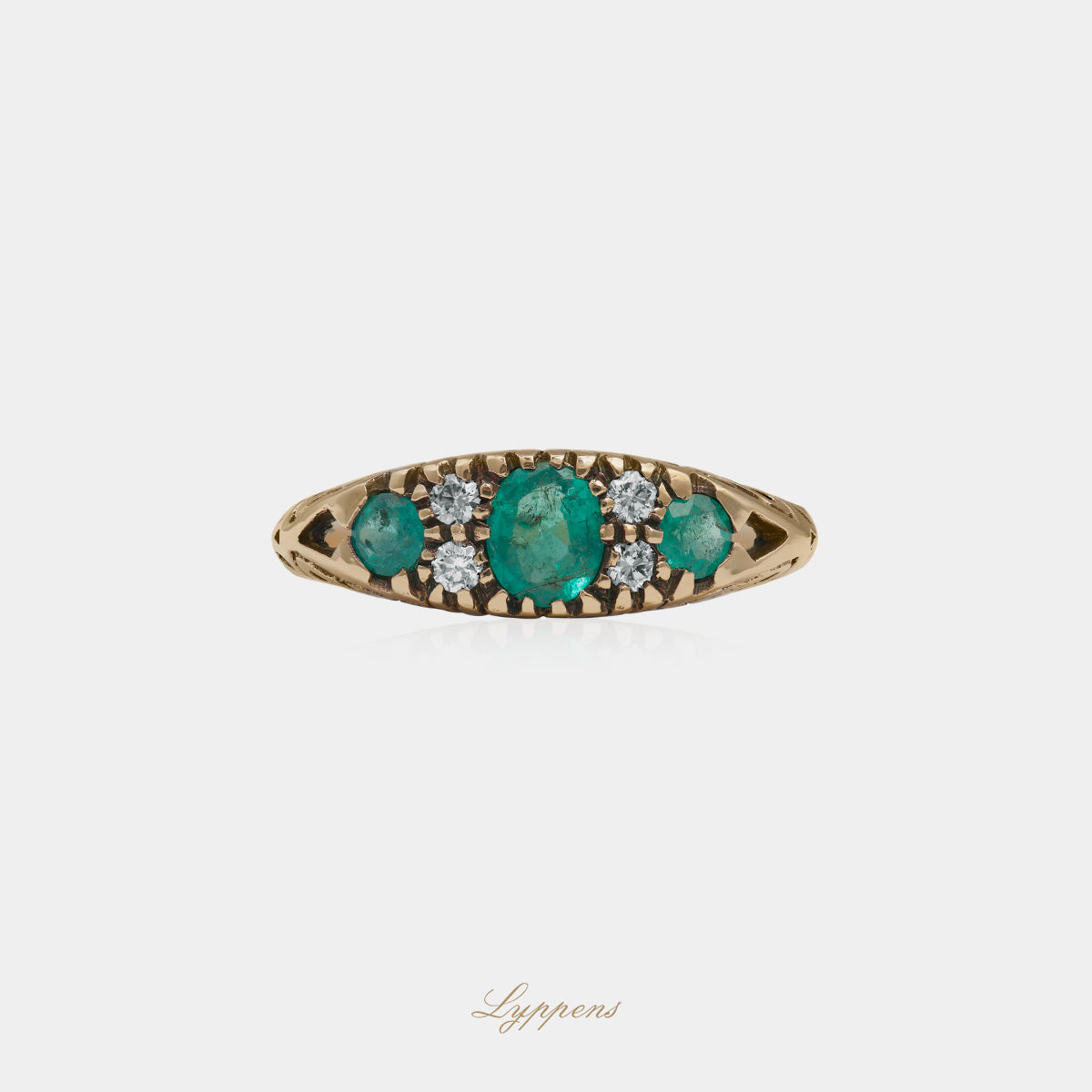 Yellow gold ring with emerald and diamonds