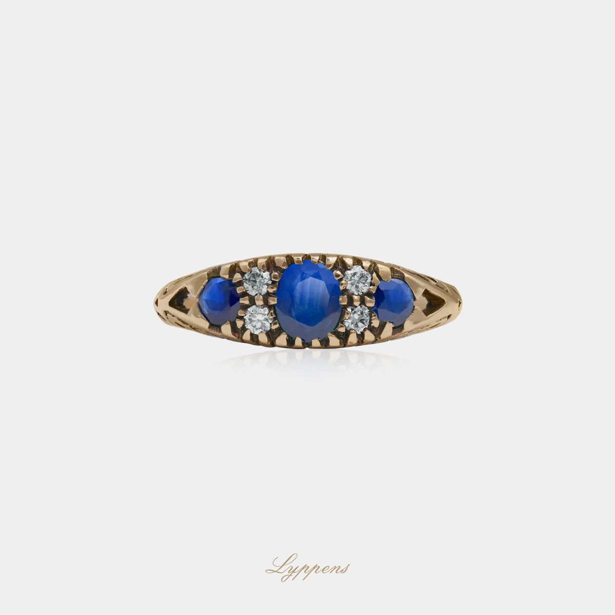 Yellow gold ring with sapphire and diamonds