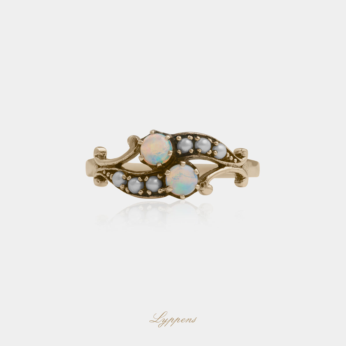 Yellow gold ring with opal and pearls