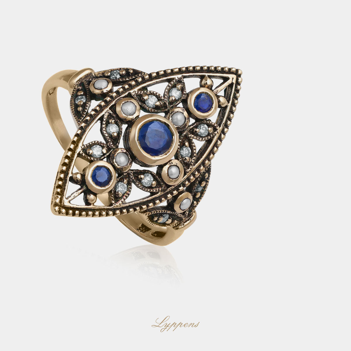 Yellow gold ring with pearl, sapphire and diamonds