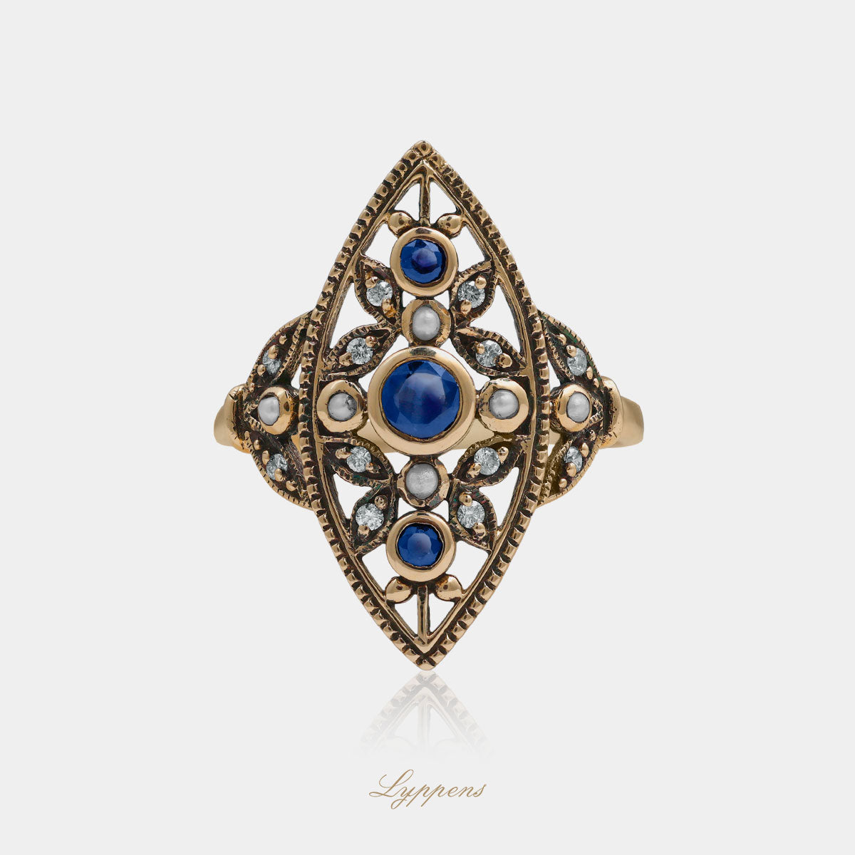 Yellow gold ring with pearl, sapphire and diamonds