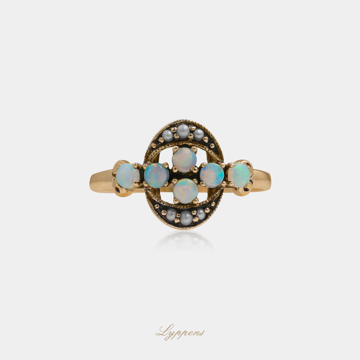 Yellow gold ring with opal and pearls