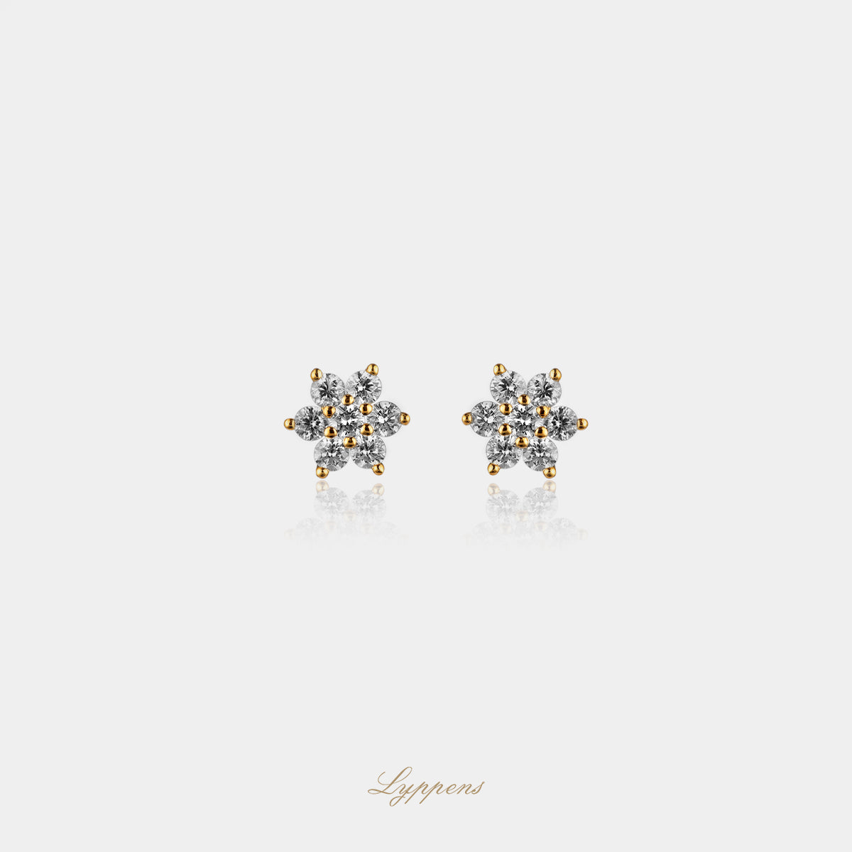 Yellow gold star earrings with diamonds
