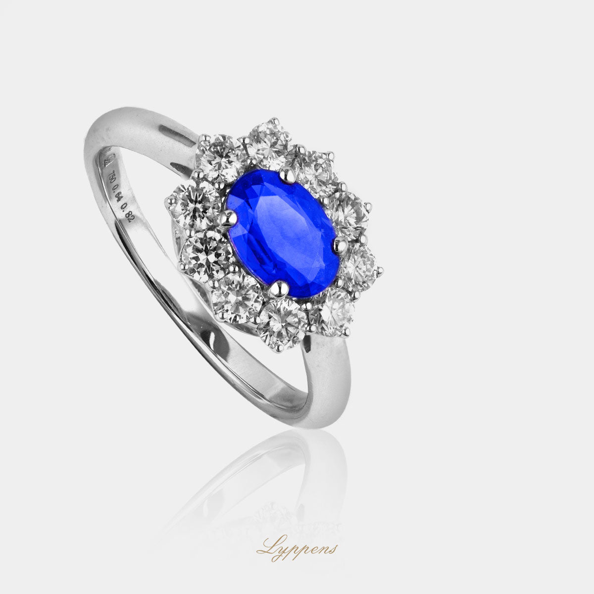 White gold entourage ring with sapphire and diamond