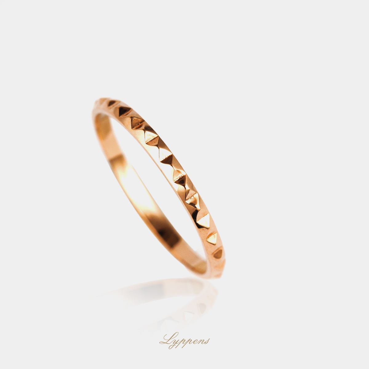 Rose gold ring with studs