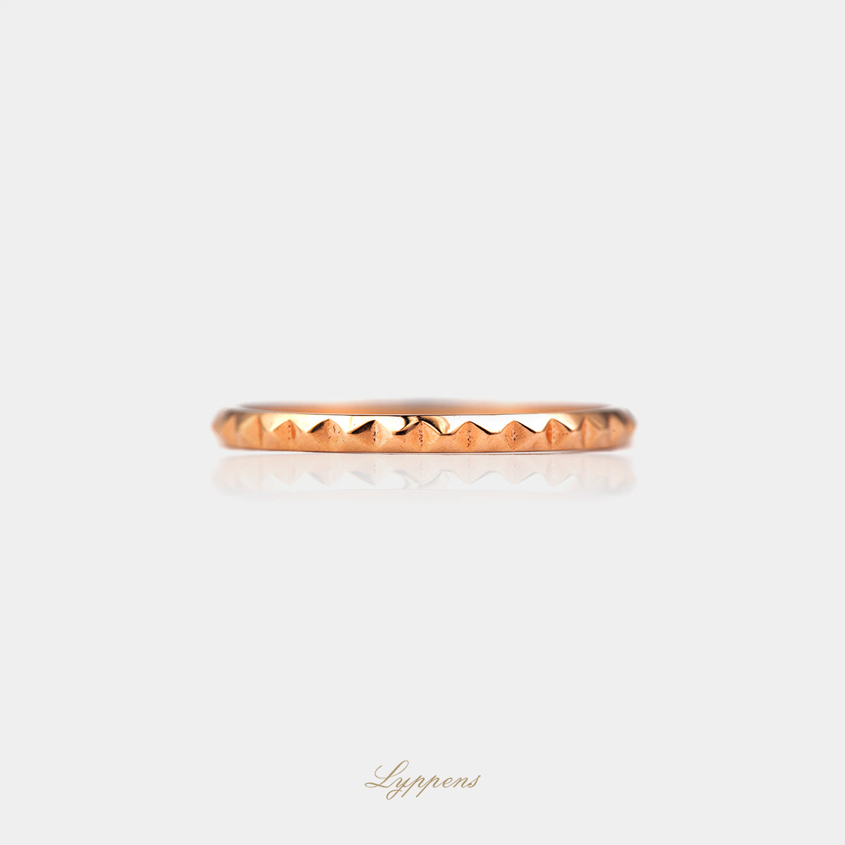 Rose gold ring with studs