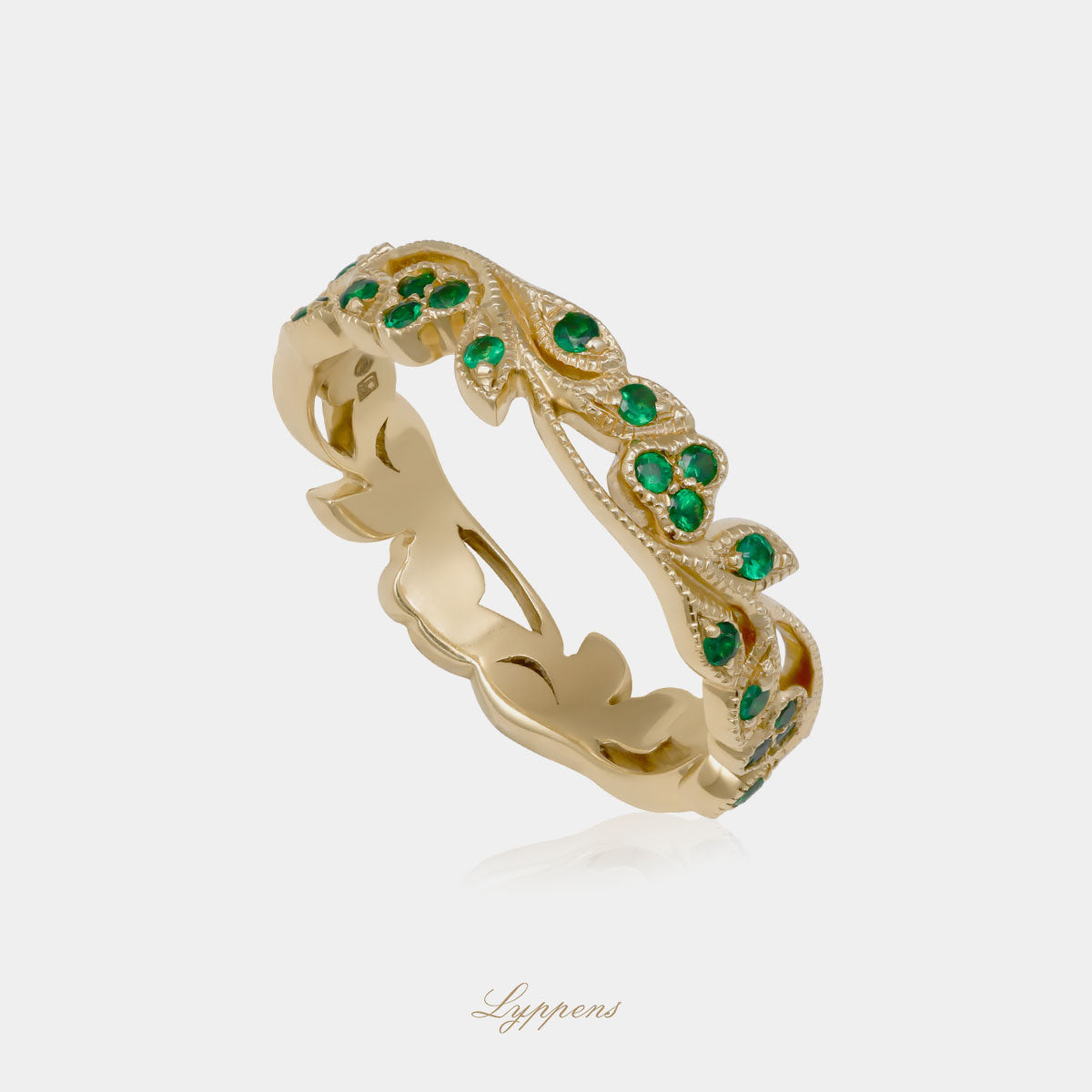 Yellow gold eternity ring with tsavorite