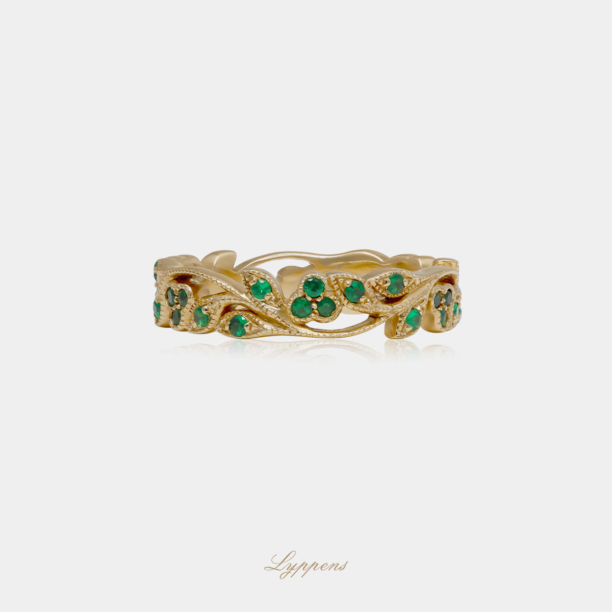 Yellow gold eternity ring with tsavorite