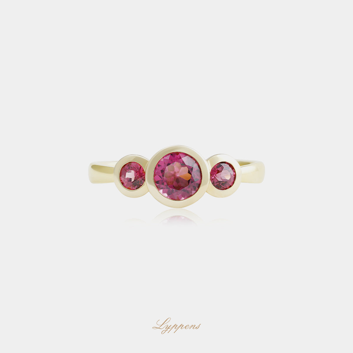Yellow gold three-stone ring with rhodolite