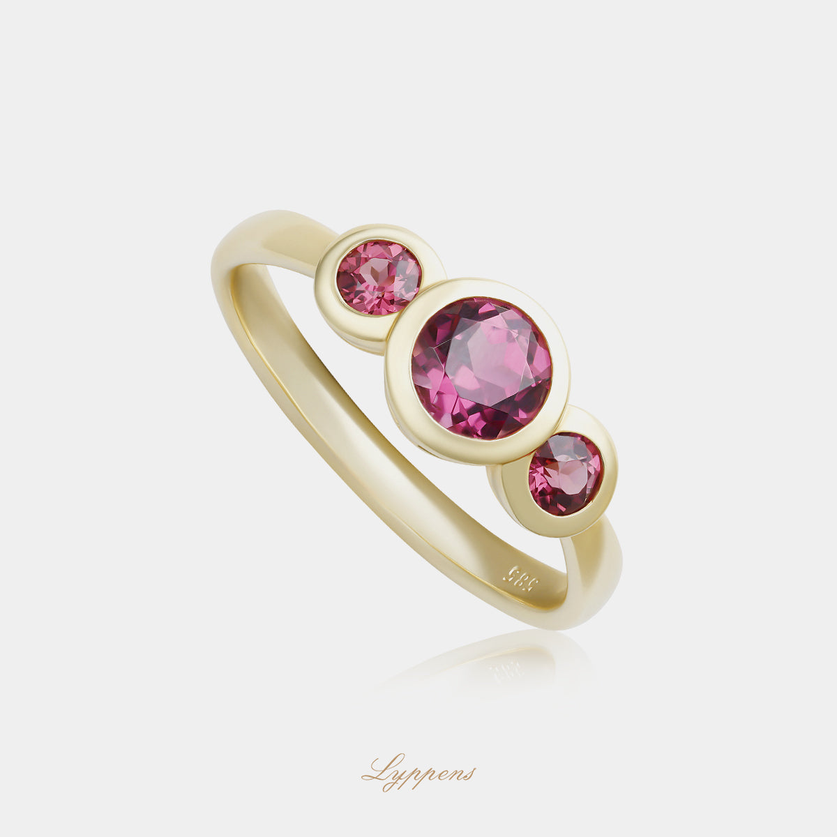 Yellow gold three-stone ring with rhodolite