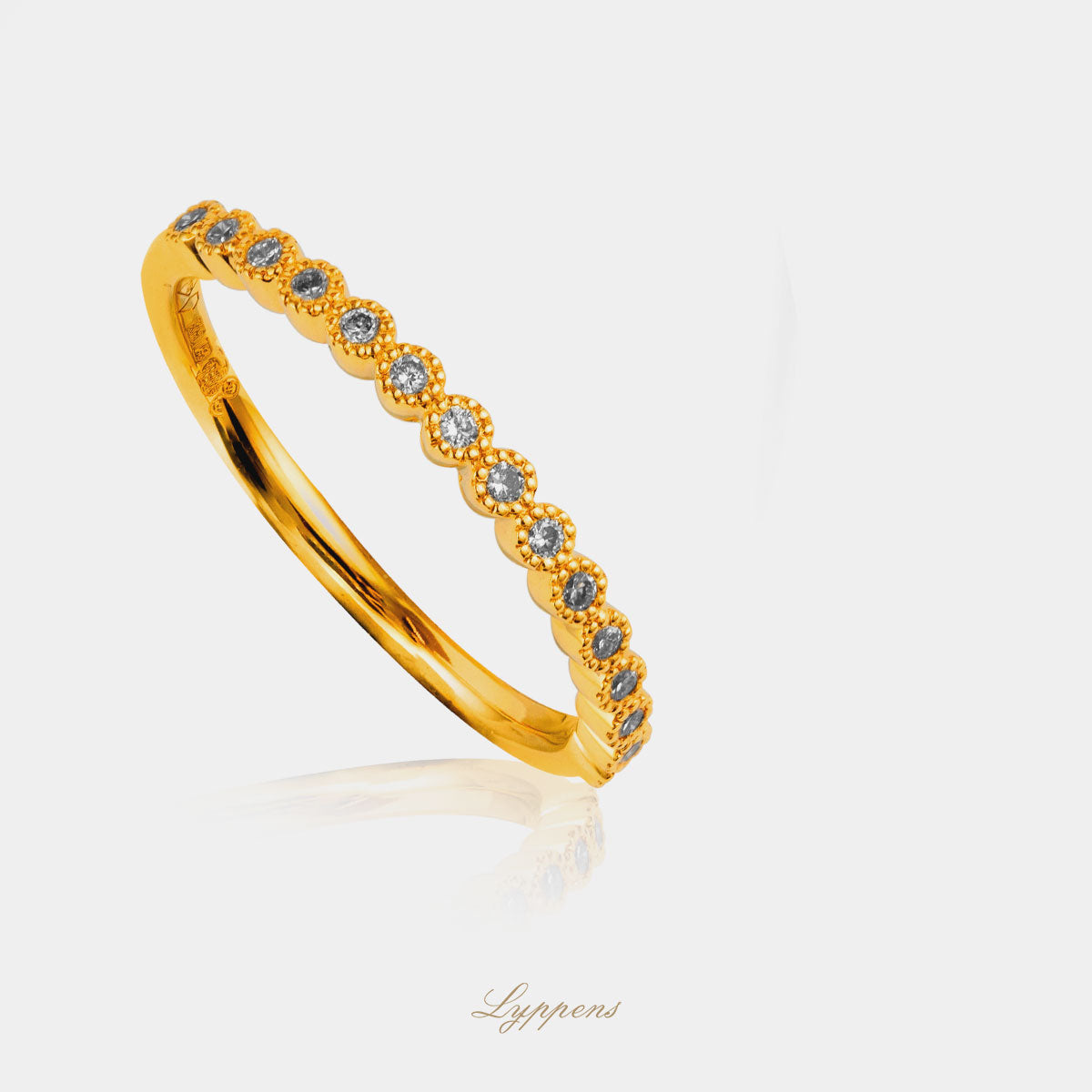 Yellow gold row ring with diamond