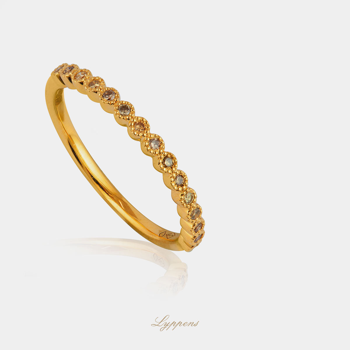 Yellow gold row ring with brown diamond