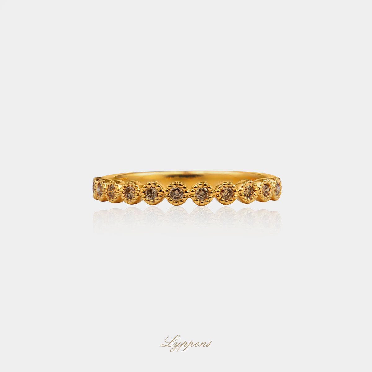 Yellow gold row ring with brown diamond