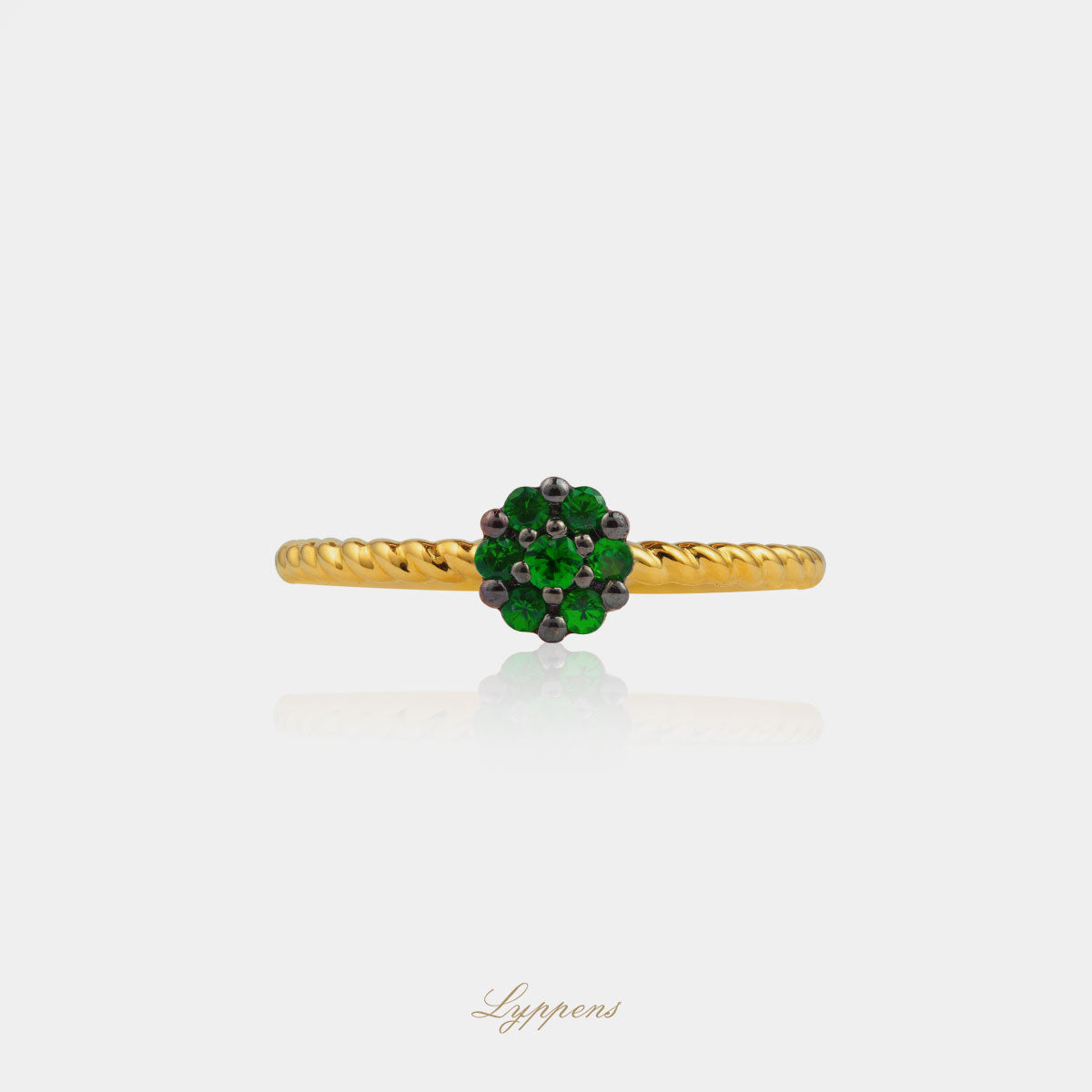 Yellow gold twisted ring with tsavorite