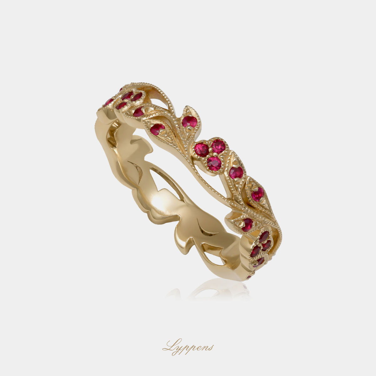 Yellow gold eternity ring with ruby