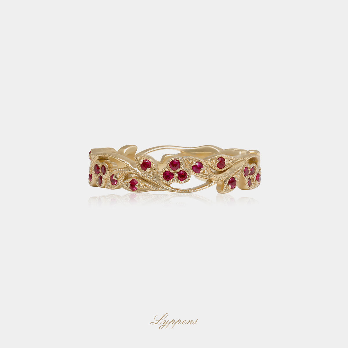 Yellow gold eternity ring with ruby