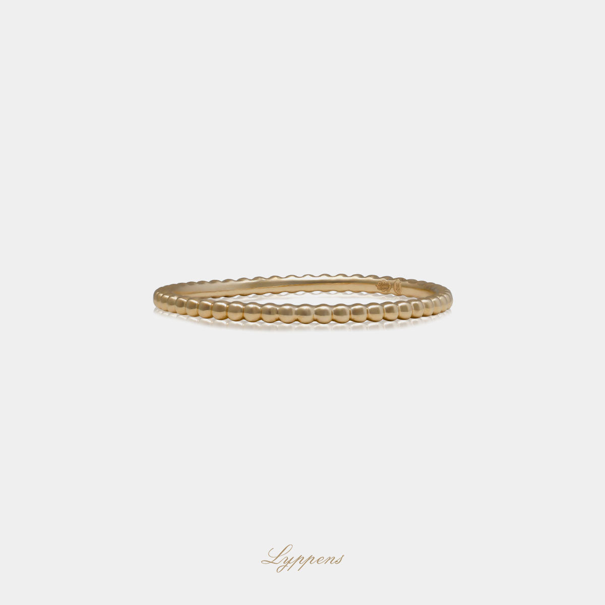 Geelgouden bolletjes ring met een breedte van 1.3mm.