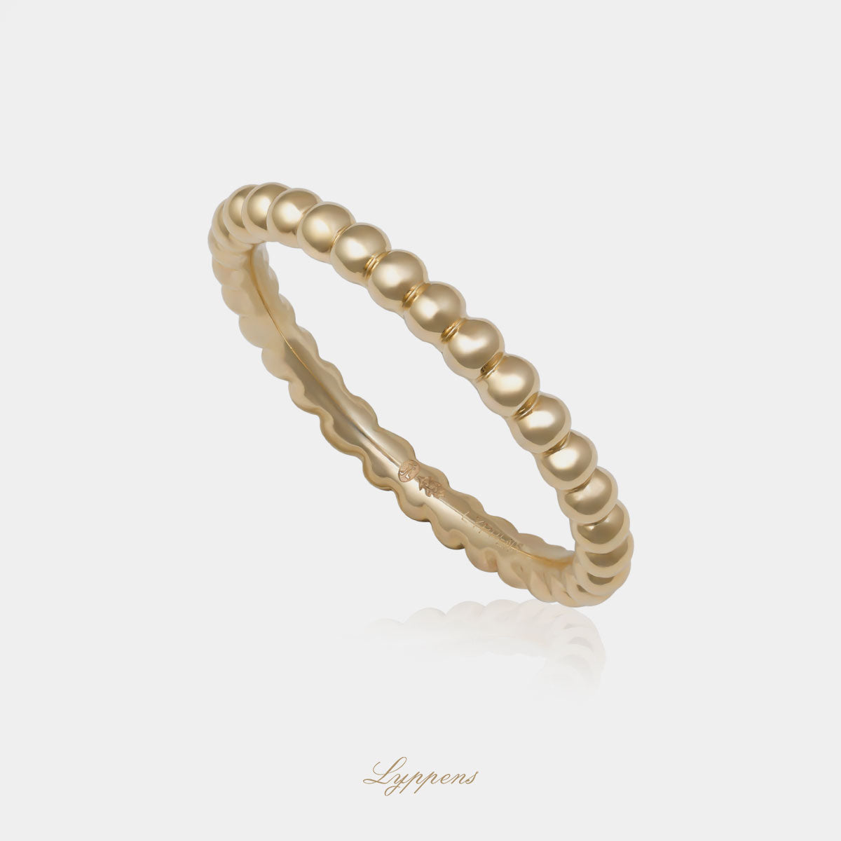 Geelgouden bolletjes ring met een breedte van 2.2mm.