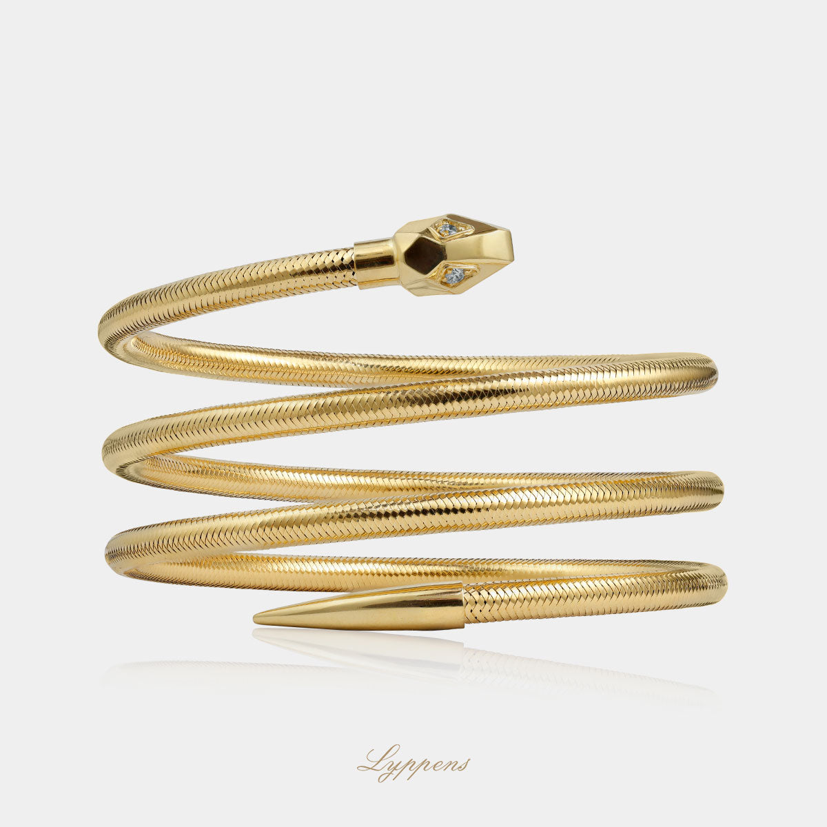 Yellow gold "snake" ring with diamonds