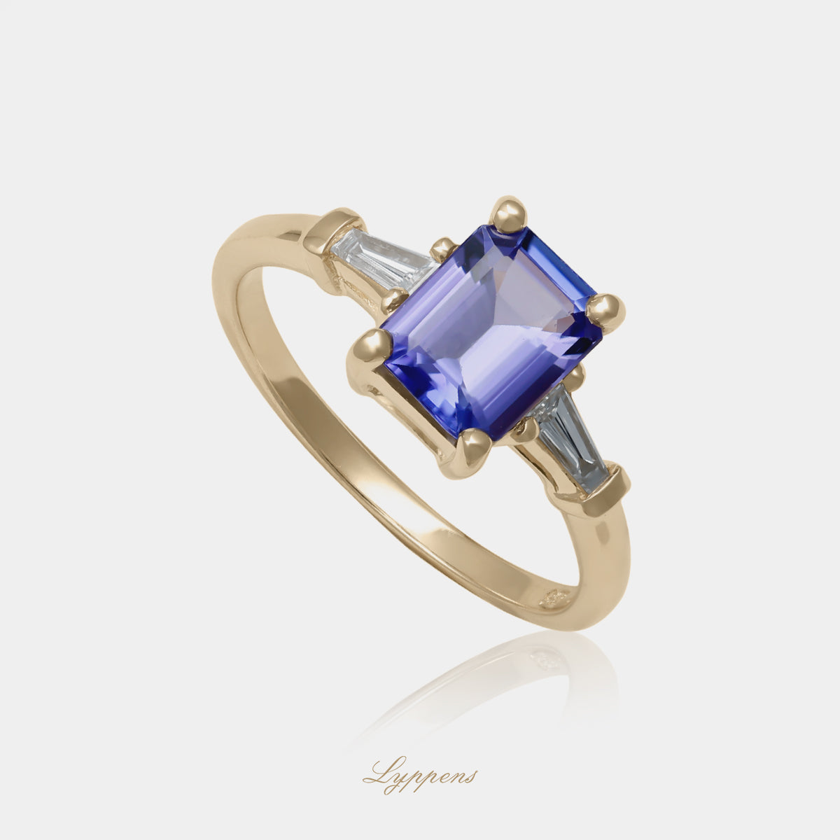 14kt geelgouden verlovingsring met tanzaniet en tapered baguette geslepen diamanten
