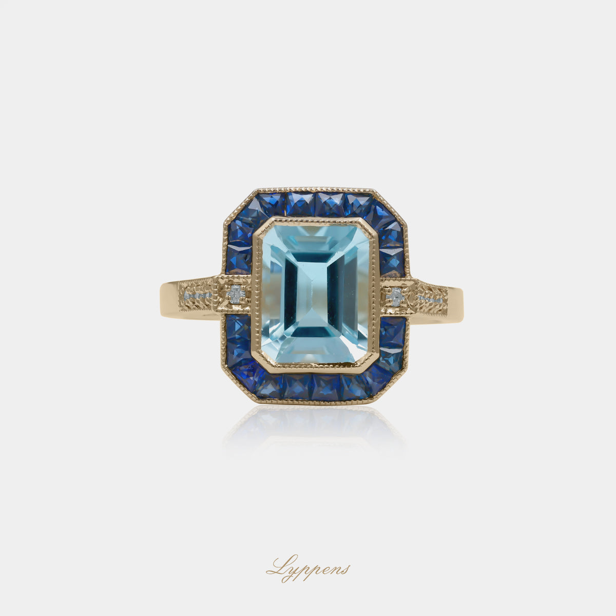 14kt geelgouden entourage ring met rechthoekig geslepen topaas, saffieren en 0.06ct briljant diamant