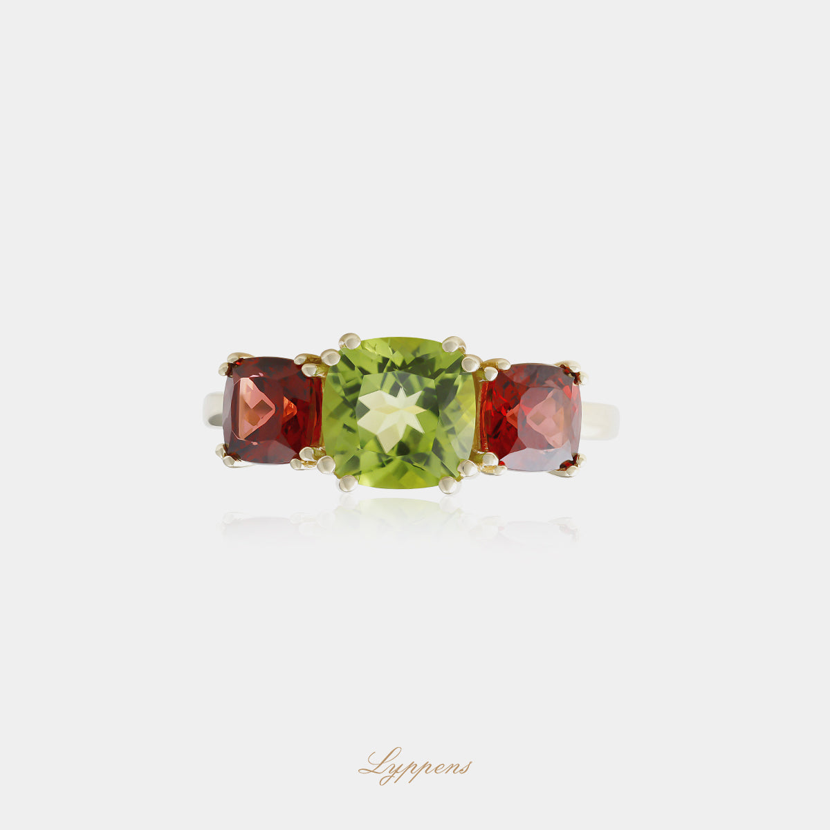Yellow gold three-stone ring with peridot and garnet