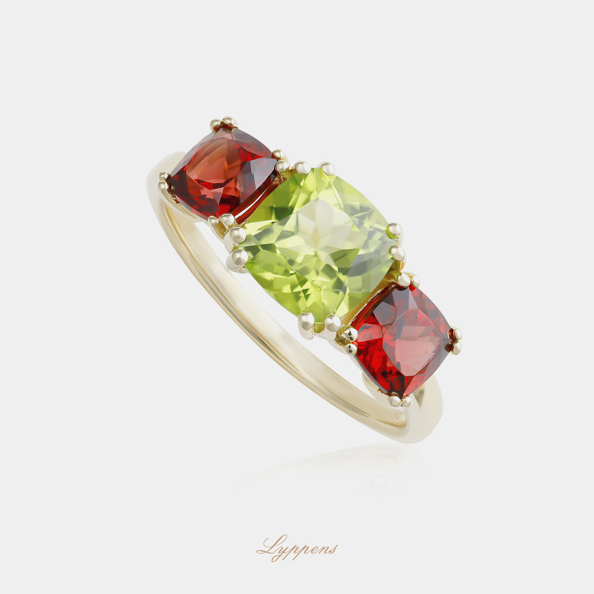 Yellow gold three-stone ring with peridot and garnet