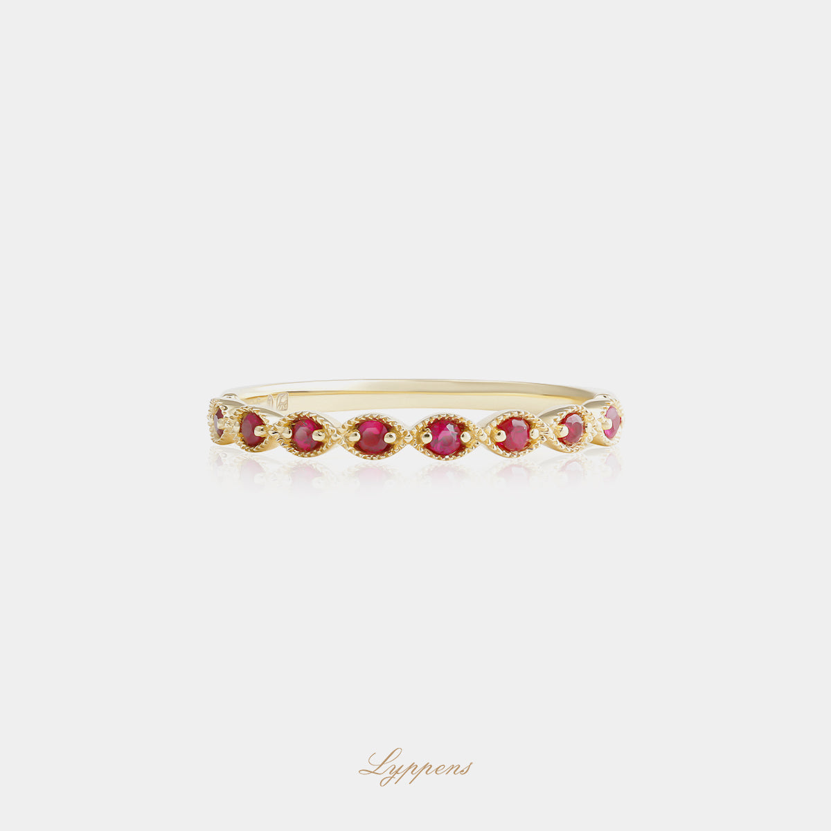 Yellow gold half eternity ring with rubies