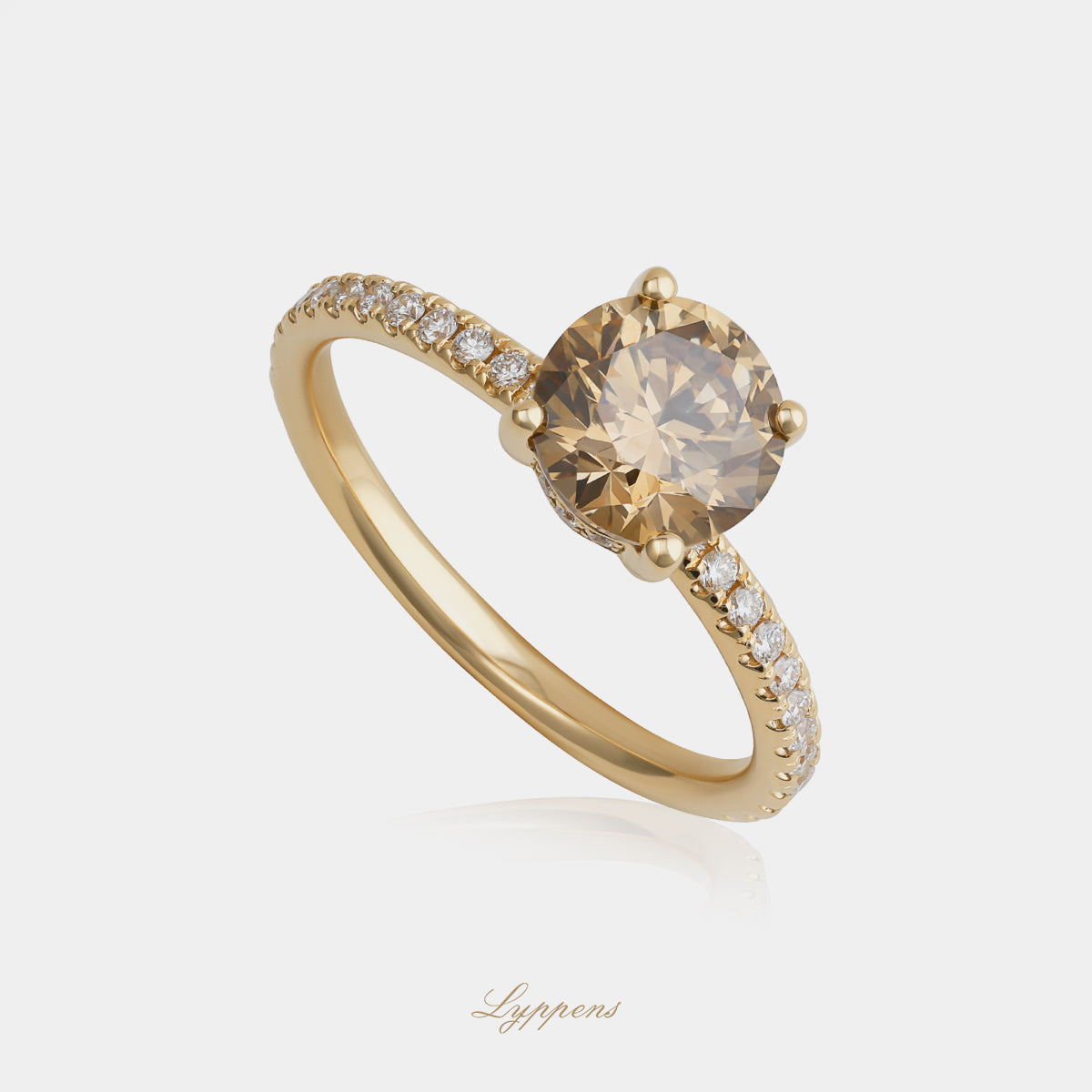 Geelgouden solitair ring met bruine en witte diamant
