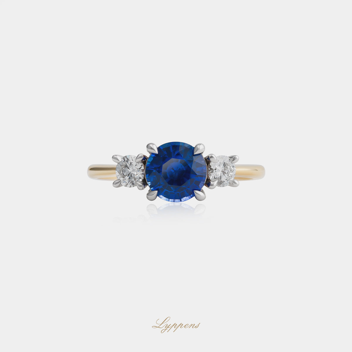18kt geel- en witgouden ring met rond saffier en briljant diamant 0.34ct G SI