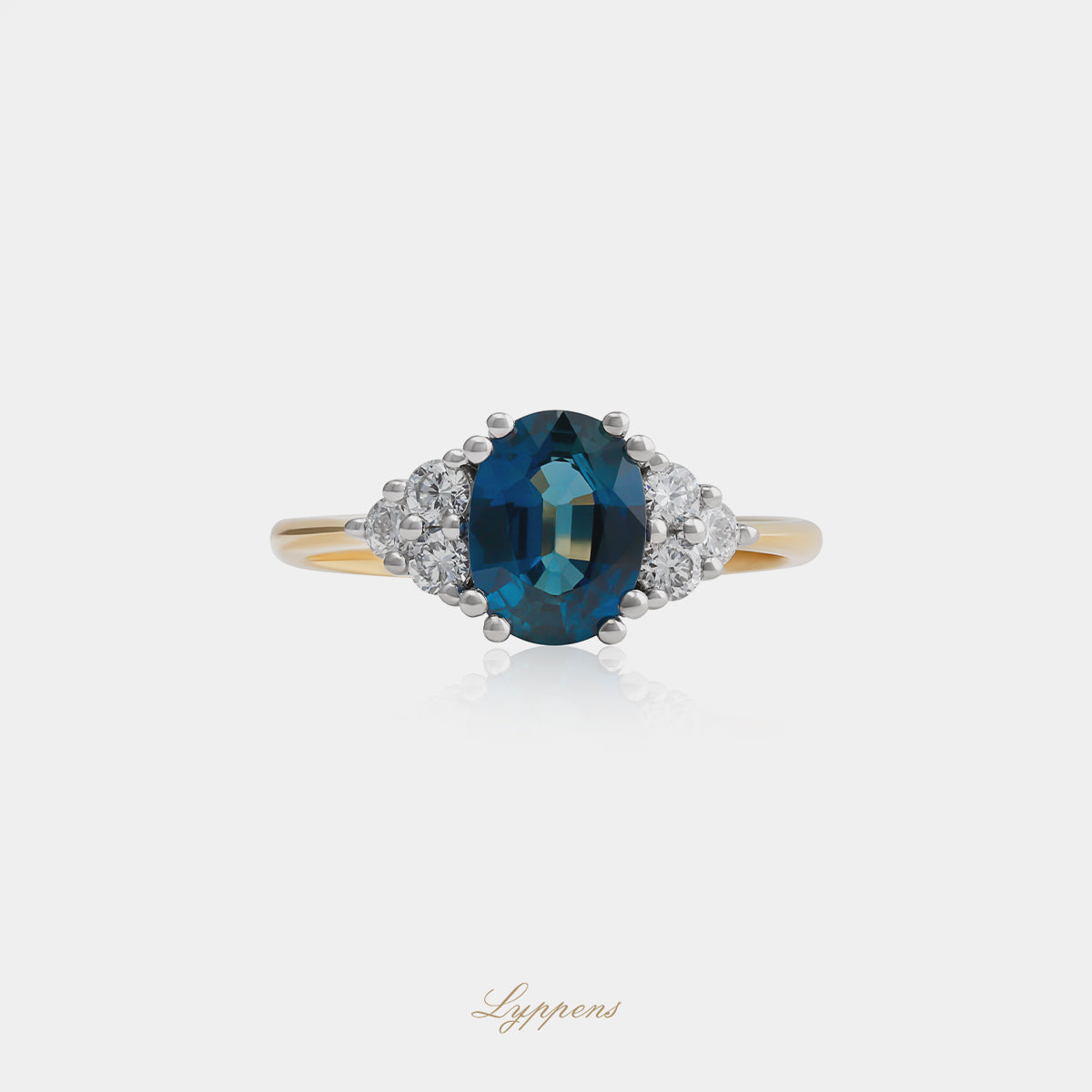 18kt geel- en witgouden ring met rond saffier en briljant diamant 0.30ct G SI1