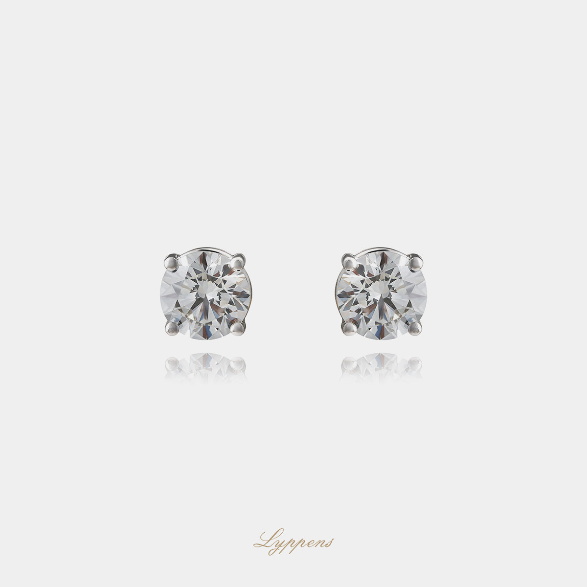 White gold solitaire earrings with diamonds
