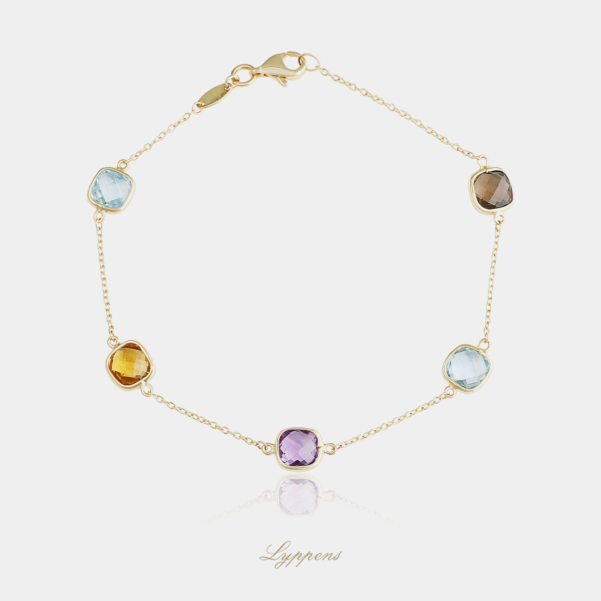Yellow gold bracelet featuring citrine, amethyst, smoky quartz and topaz