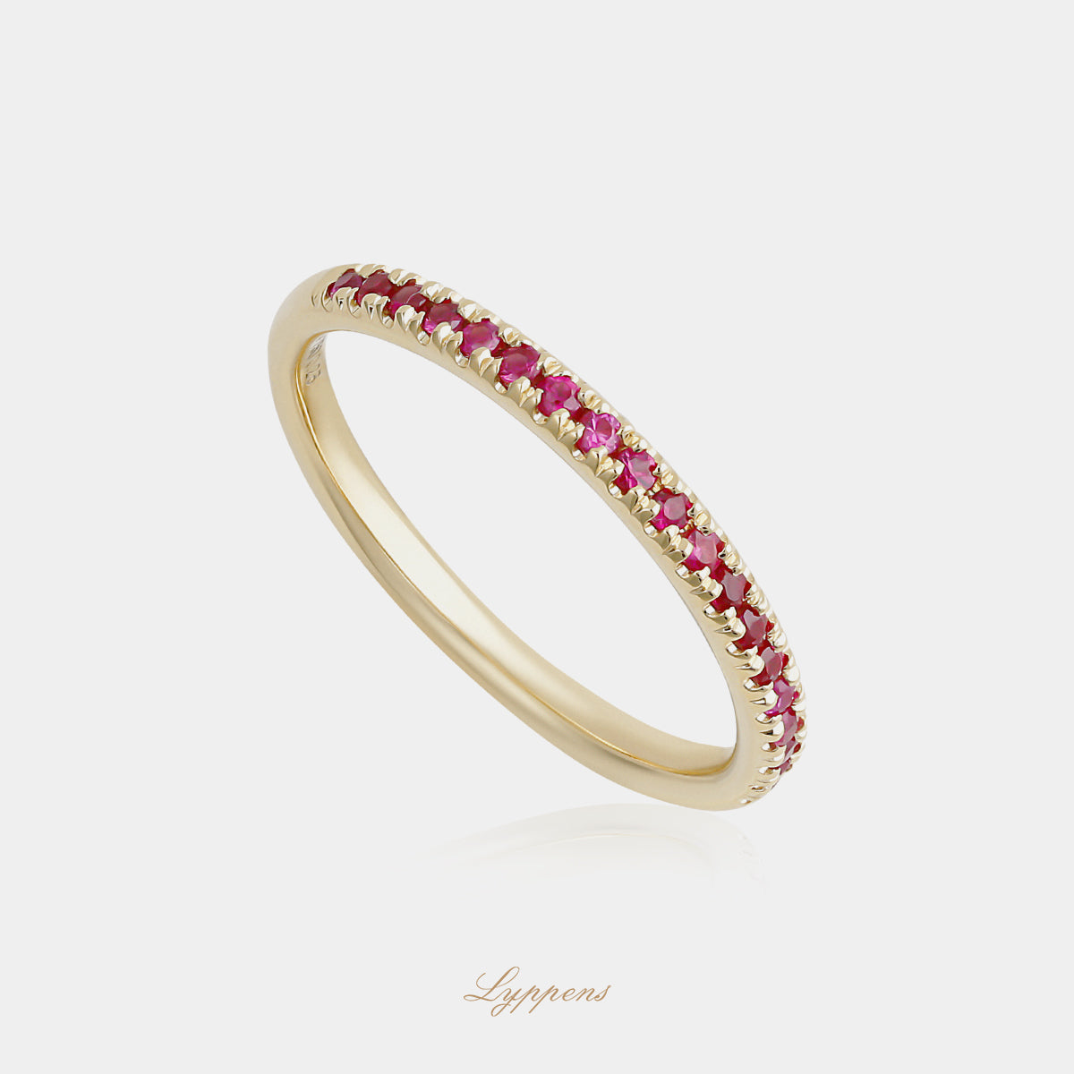 Yellow gold half eternity ring with rubies