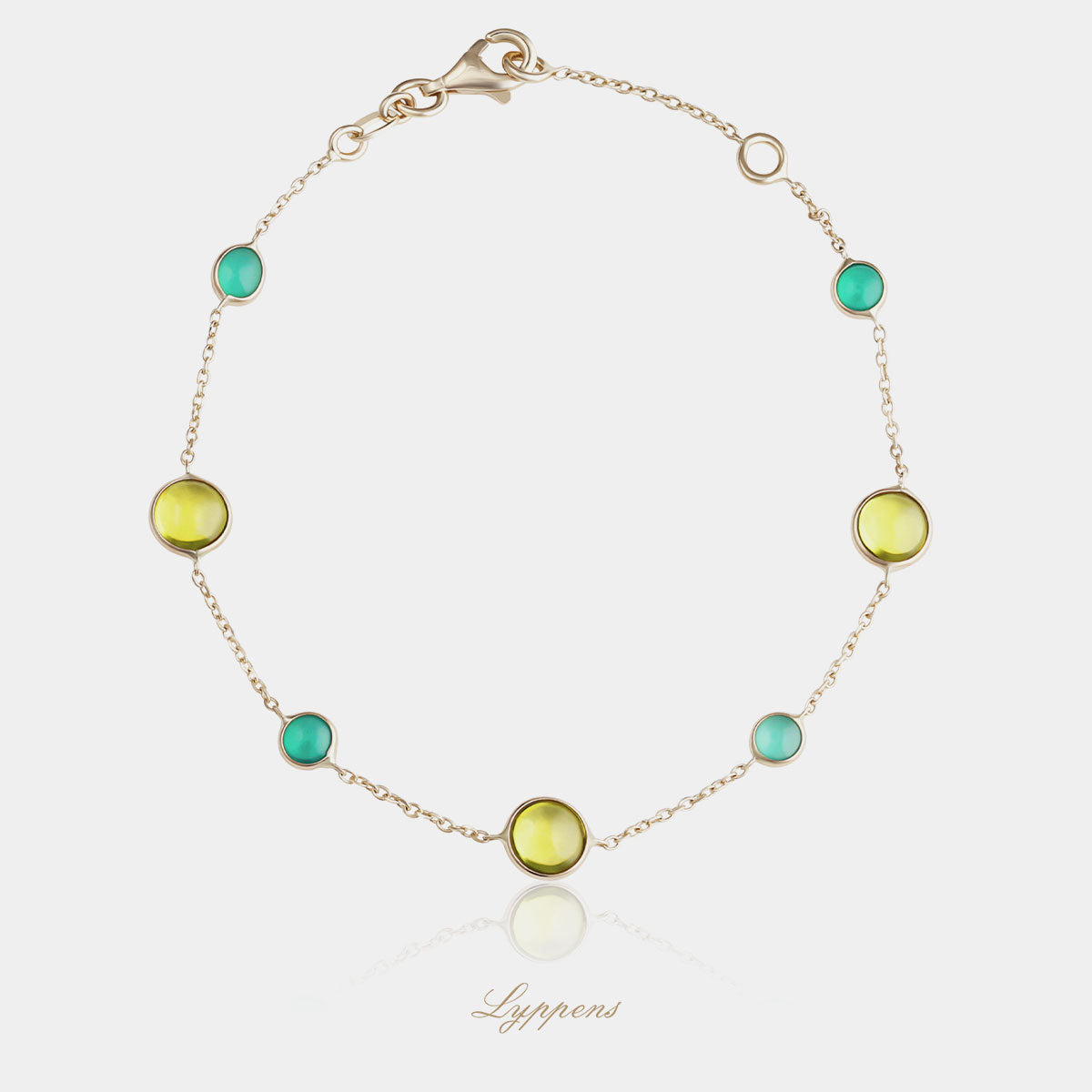 Yellow gold bracelet featuring peridot and agate