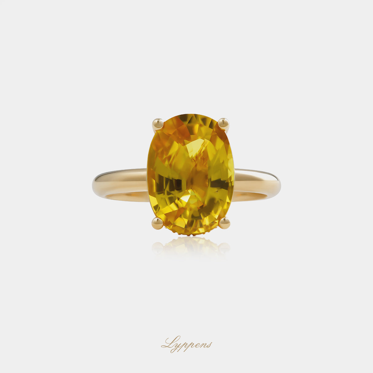 Yellow gold solitaire ring with yellow sapphire and white diamonds