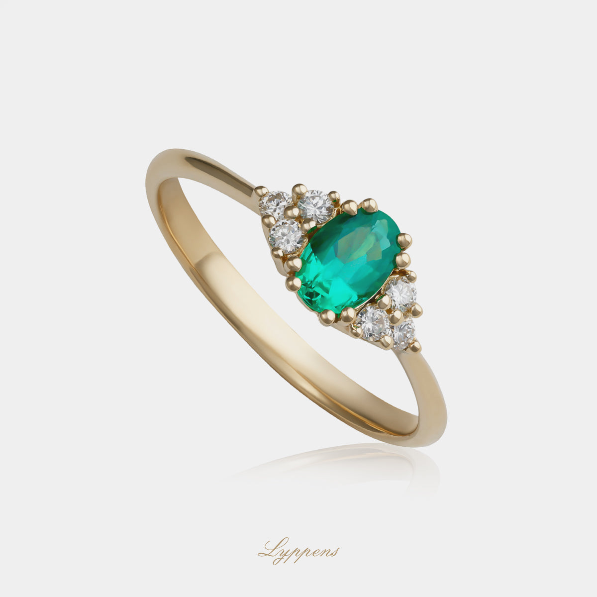 Geelgouden ring met smaragd en diamant