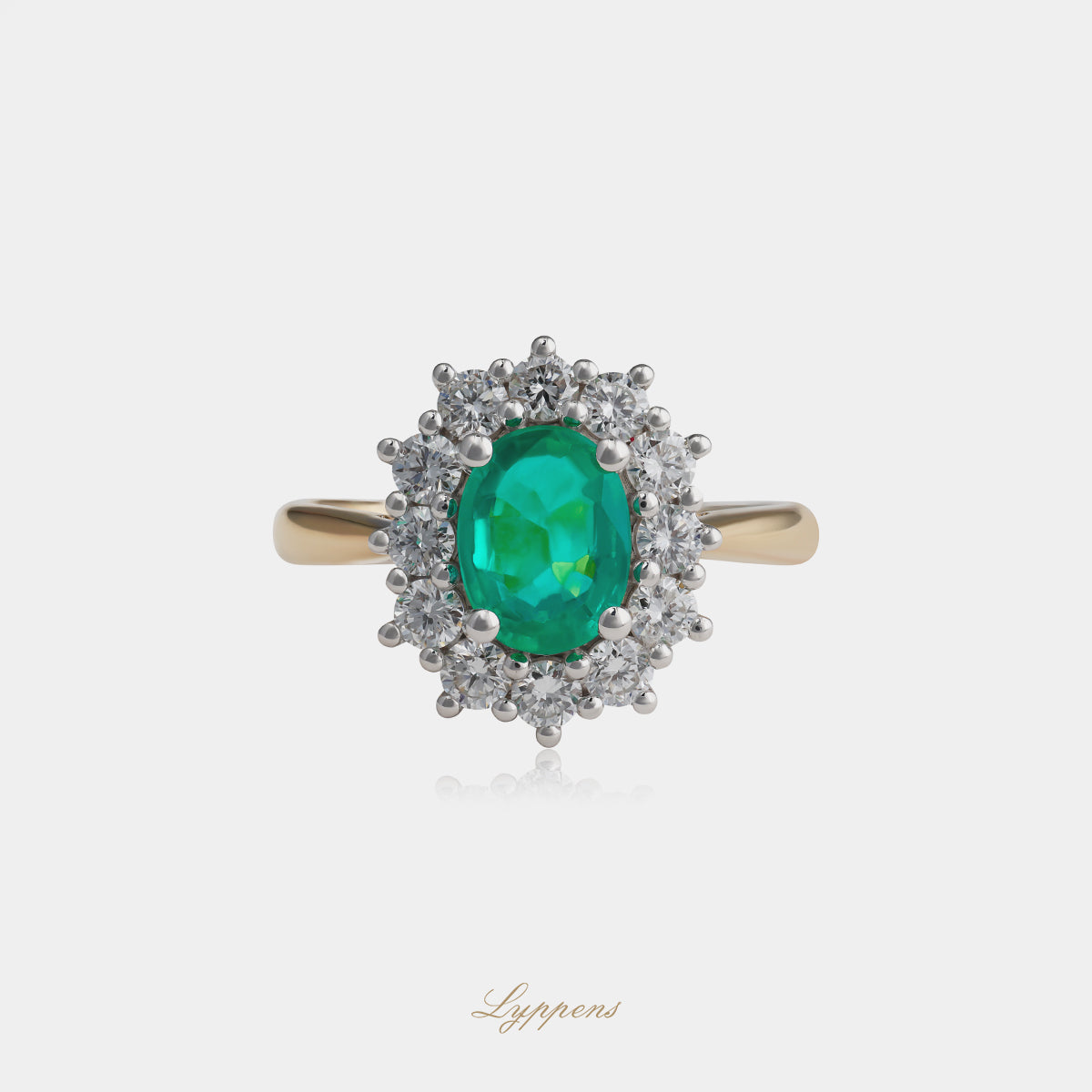 Geelgouden entourage ring met smaragd en diamant