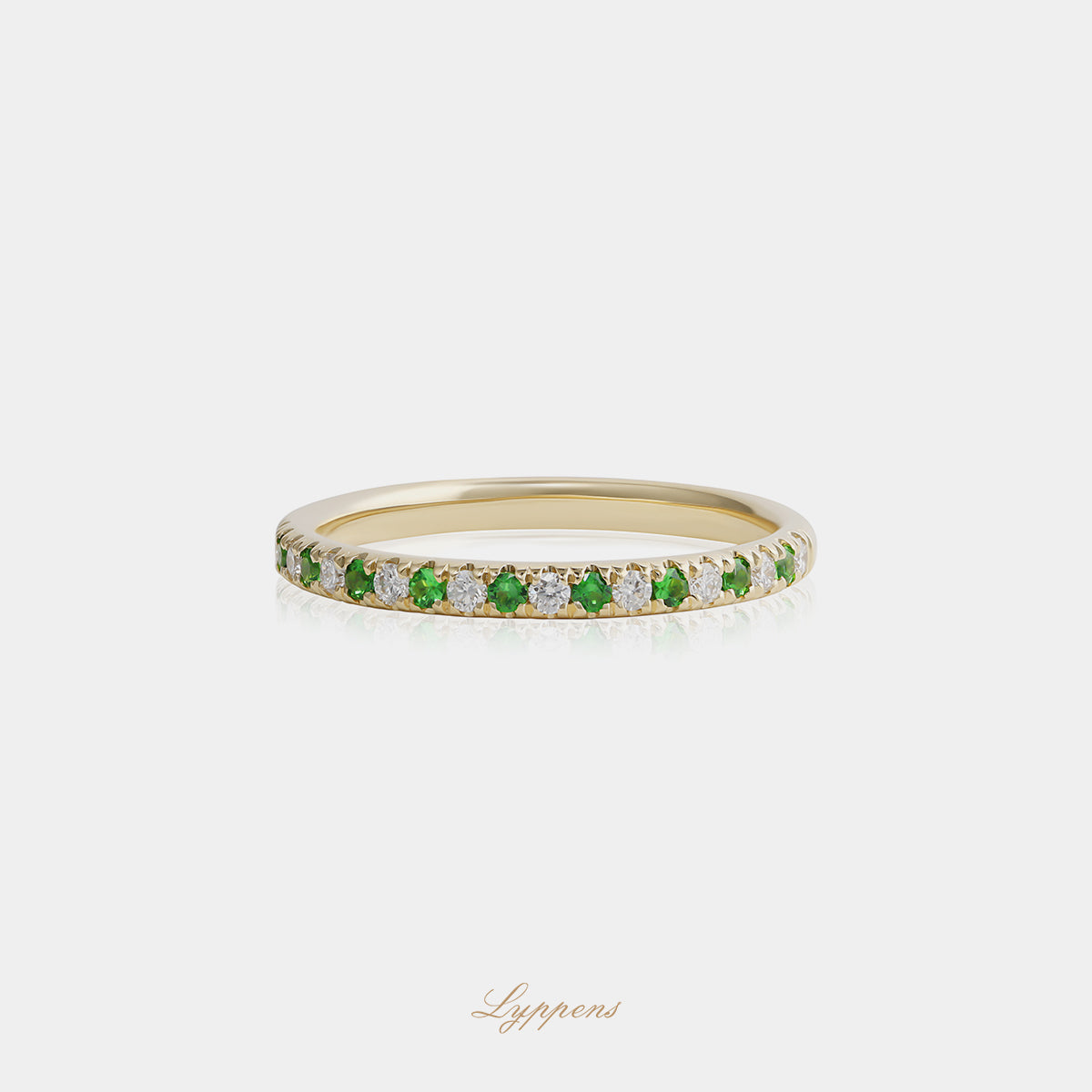 Yellow gold half eternity ring with tsavorite and diamond