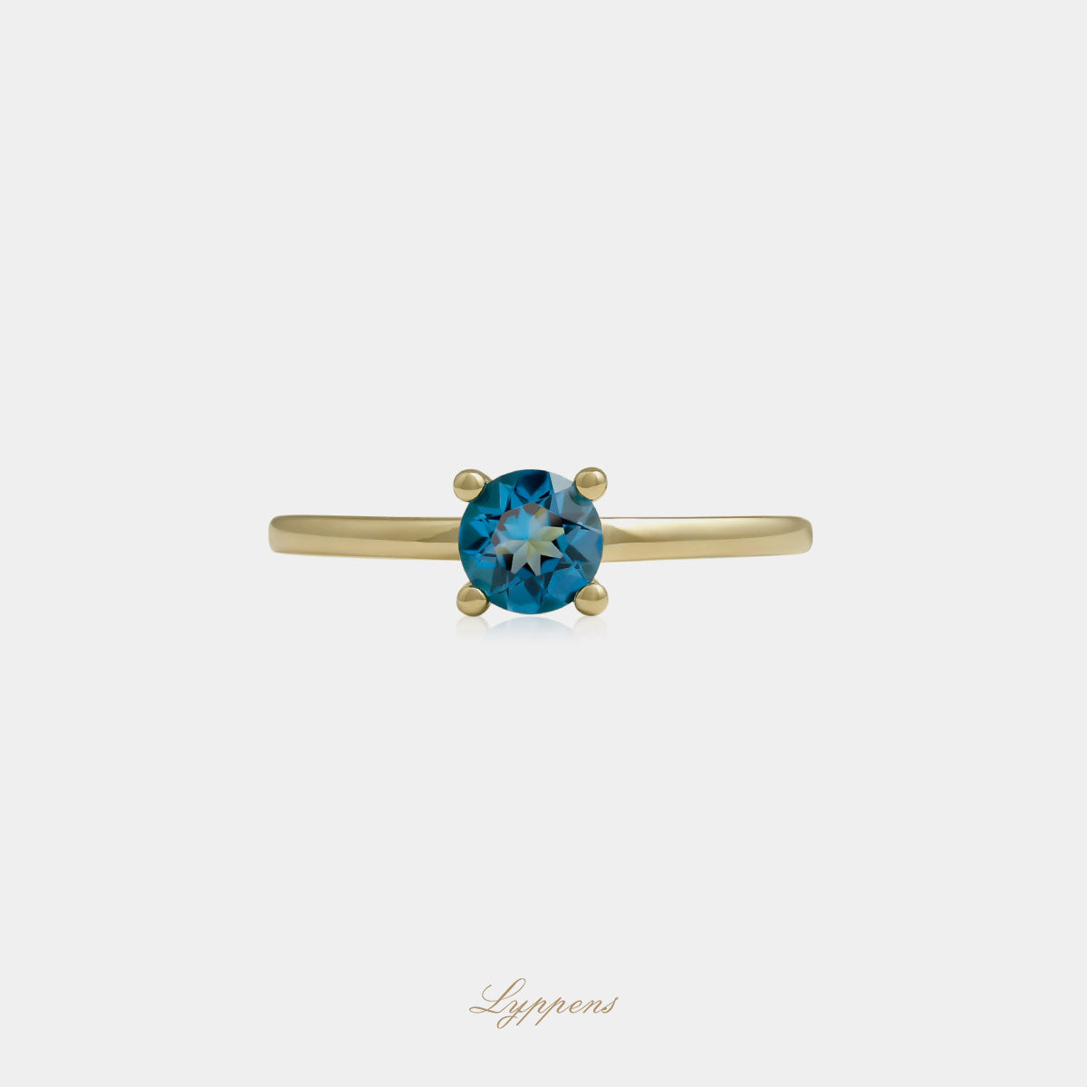Yellow gold solitaire ring with topaz