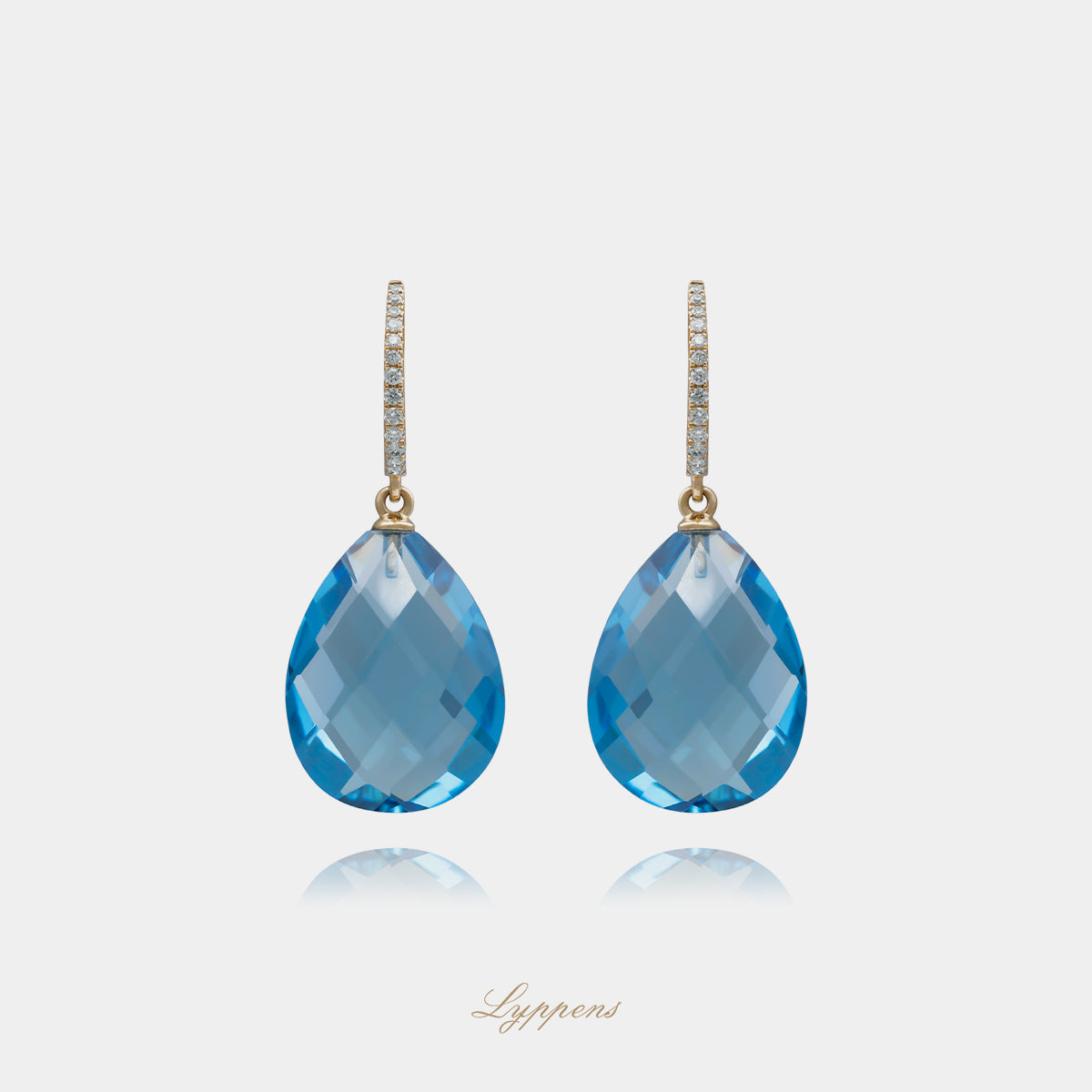 Yellow gold earrings with topaz and diamonds