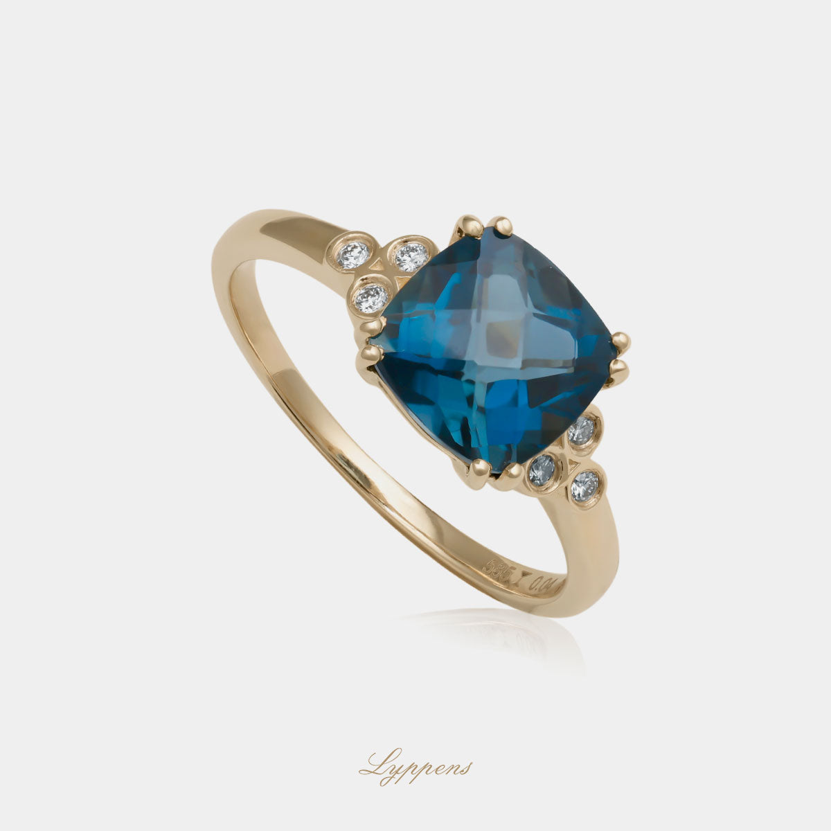 Yellow gold ring with topaz and diamonds