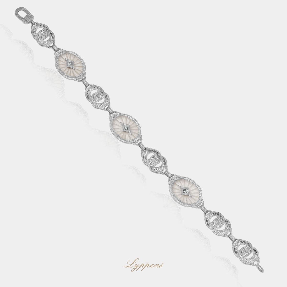 Witgouden vintage armband met bergkwarts en achtkant geslepen diamant.