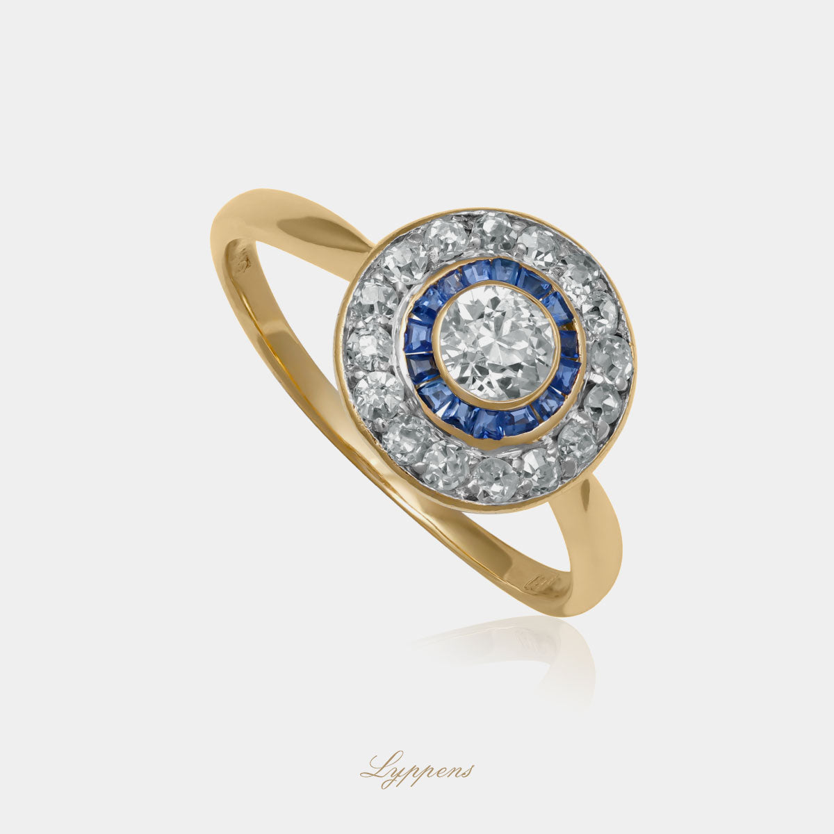 Yellow gold Art Deco target ring with sapphire and diamonds