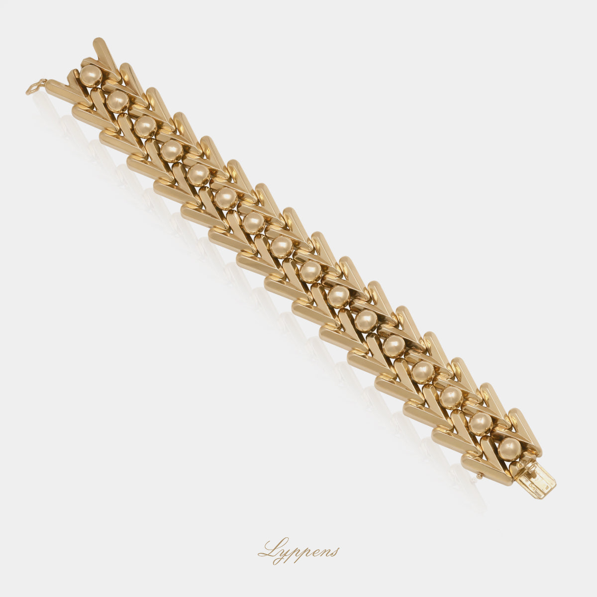 18kt roségouden vintage jaren '50 schakelarmband opgebouwd uit V vormige schakels 